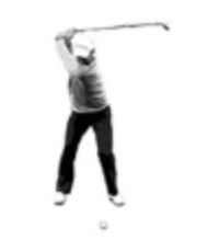 A golfer at P4, top of the backswing, seen face on